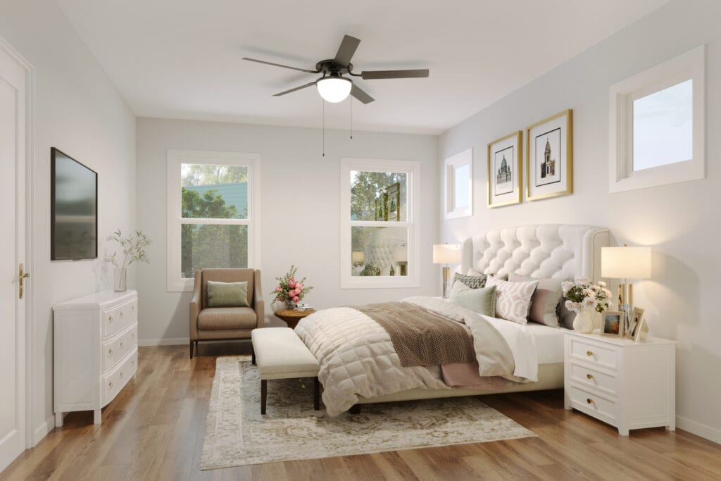 Primary bedroom with large windows and natural light
